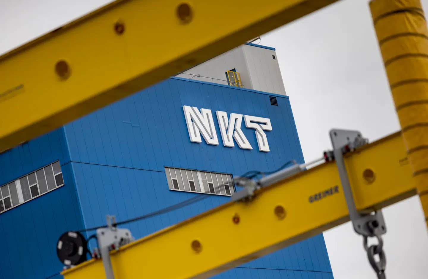 24 August 2023, North Rhine-Westphalia, Cologne: The logo "NKT" is placed on a company building on the factory premises. NKT GmbH & Co KG develops, manufactures and installs turnkey low, medium and high voltage cable solutions that enable sustainable power transmission. Photo by: Thomas Banneyer/picture-alliance/dpa/AP Images