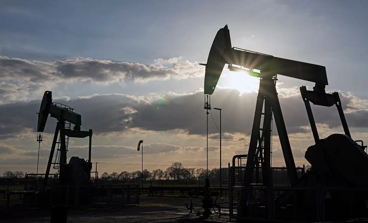 FILE - A pumpjack of Wintershall DEA extracts crude oil at an old oil field in Emlichheim, Germany, March 18, 2022. Falling crude oil prices and lingering worries about the global economy have been sapping power from energy stocks throughout 2023. (AP Photo/Martin Meissner, File)