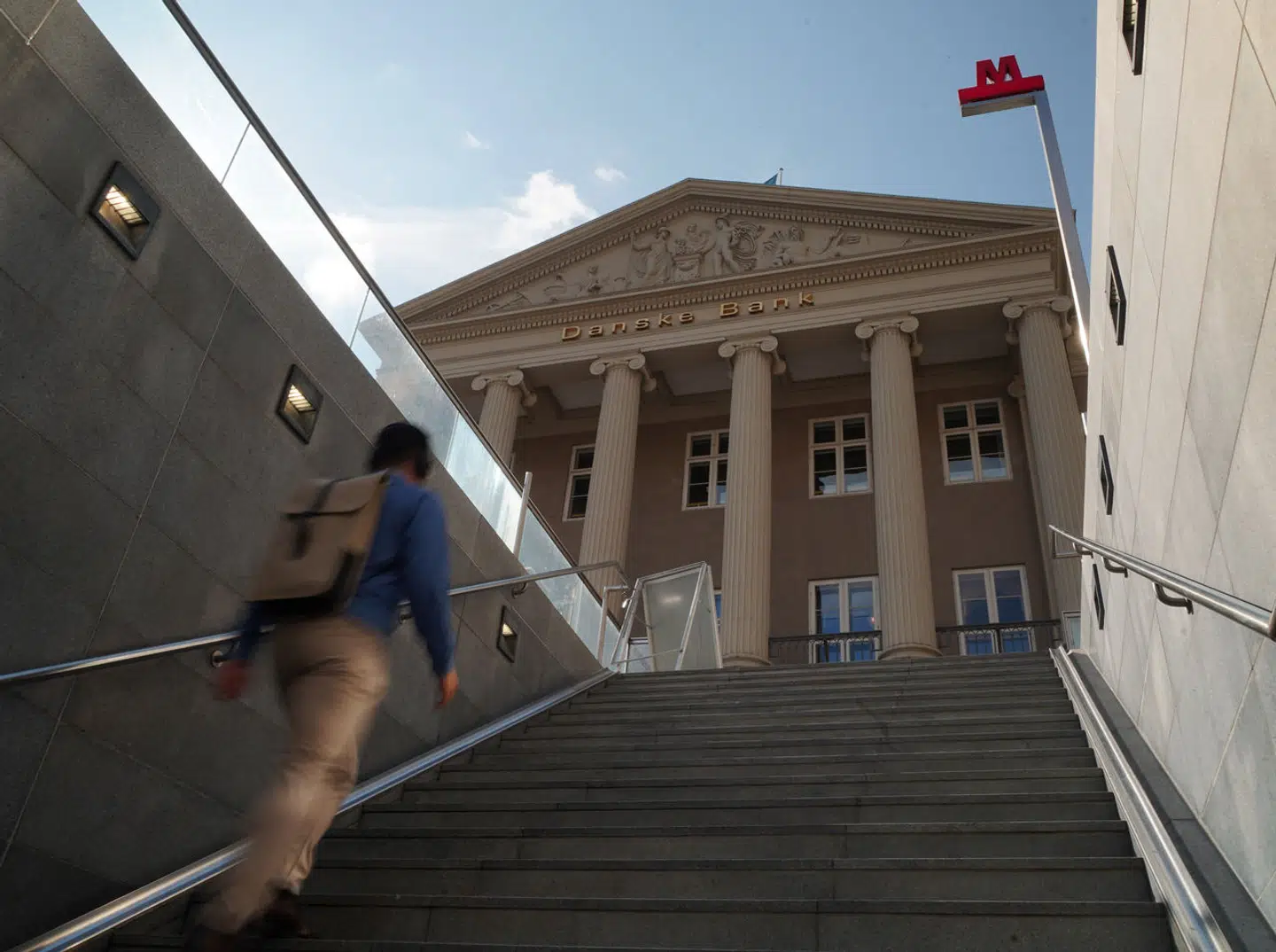 A man walks towards the head office of Danske Bank in Copenhagen, Denmark, July 21. 2023. REUTERS/Tom Little