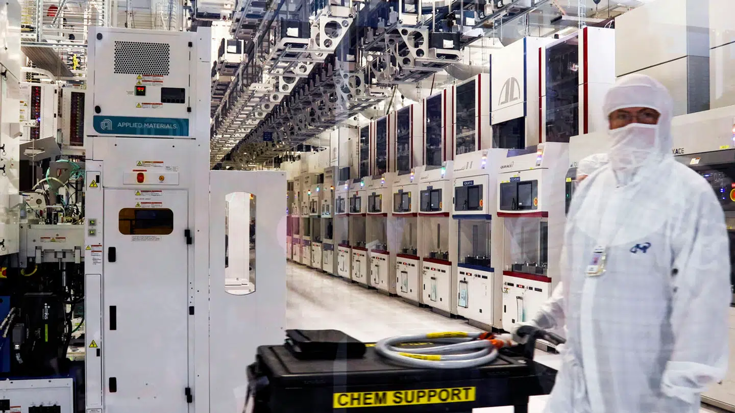 A Micron Technology, Inc. employee moves through a clean room at an existing fab facility in Boise, Idaho, Monday, Sept. 12, 2022. A new, $15 billion, leading-edge microchip factory will begin construction soon near the Idaho-based chipmaker's existing East Boise plant. (Darin Oswald/Idaho Statesman via AP)