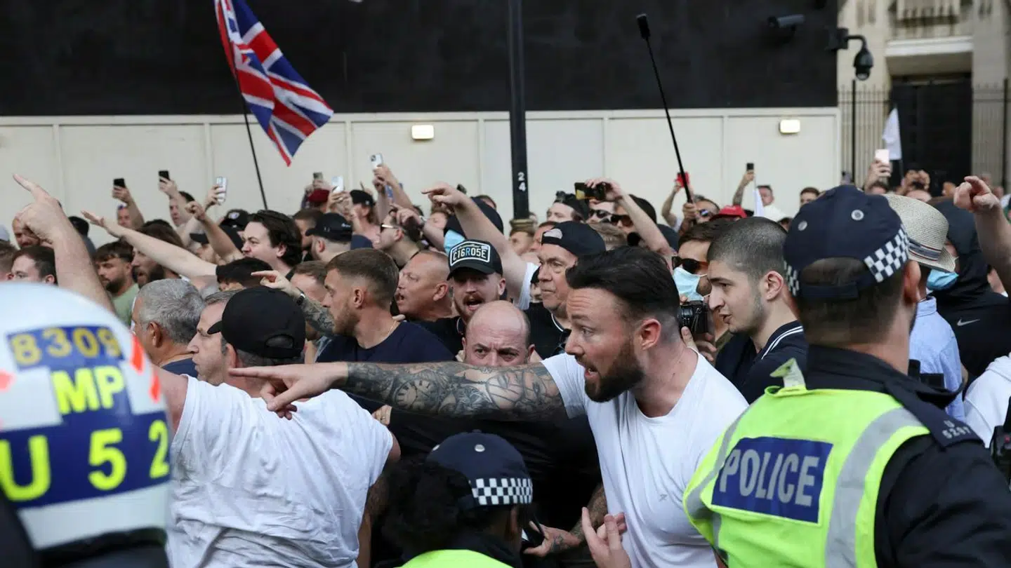 Police officers operate during a protest against illegal immigration outside of Downing Street in London Britain, July 31, 2024. REUTERS/Hollie Adams