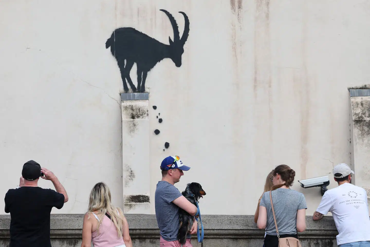 People view a new artwork by the British artist Banksy, in Kew, west London, Britain, August 5, 2024. REUTERS/Toby Melville