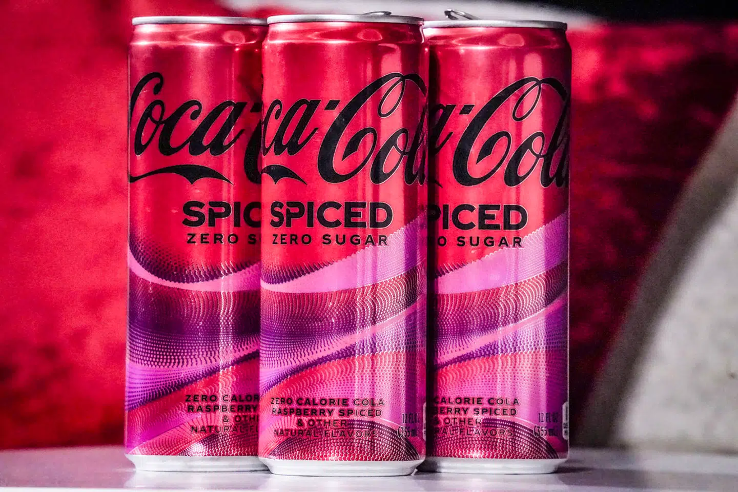 Cans of Coca-Cola Spiced, the beverage company's first new permanent offering to its North American portfolio in three years, are introduced at a livestream media event, Tuesday, Feb. 6, 2024, in New York. (AP Photo/Bebeto Matthews)