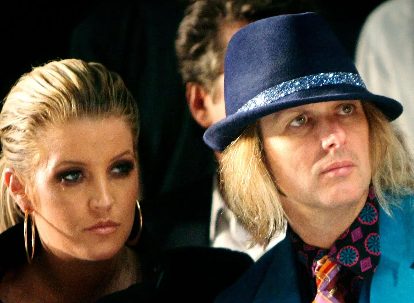 FILE - Lisa Marie Presley and her husband, Michael Lockwood, watch the Anna Sui 2008 spring/summer show at Fashion Week in New York, Sept. 10, 2007. Presley, singer and only child of Elvis, died Thursday, Jan. 12, 2023, after a hospitalization, according to her mother, Priscilla Presley. She was 54. (AP Photo/Seth Wenig, File)