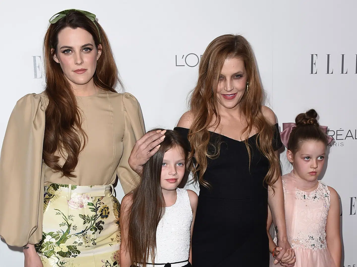 FILE - Lisa Marie Presley, second right, her daughter Riley Keough, left, and her twin daughters Finley Lockwood and Harper Lockwood, arrive at the 24th annual ELLE Women in Hollywood Awards at the Four Seasons Hotel Beverly Hills on Monday, Oct. 16, 2017, in Los Angeles. Lisa Marie Presley, singer and only child of Elvis, died Thursday, Jan. 12, 2023, after a hospitalization, according to her mother, Priscilla Presley. She was 54. (Photo by Jordan Strauss/Invision/AP, File)