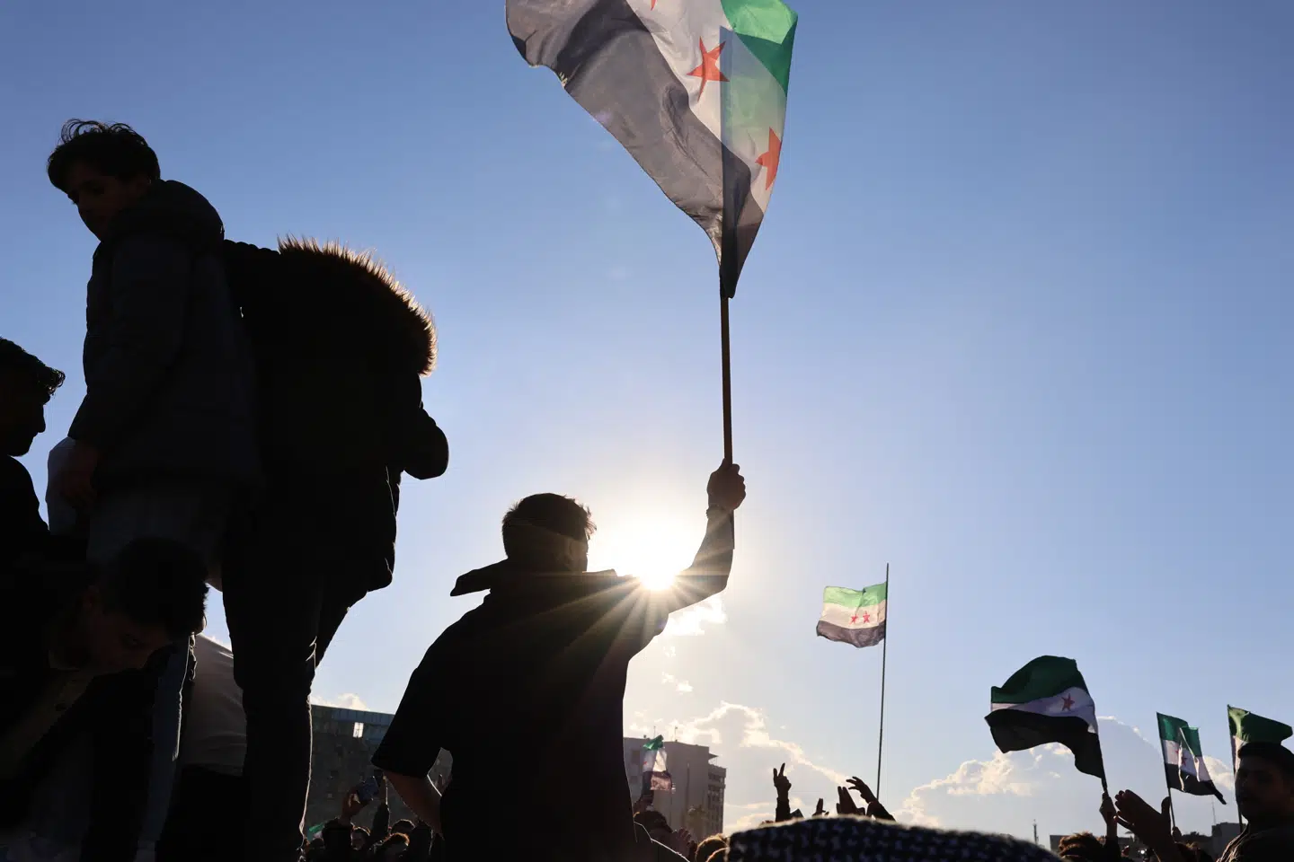 Folk samledes på gaderne i Damaskus 13. december for at fejre regimets fald.