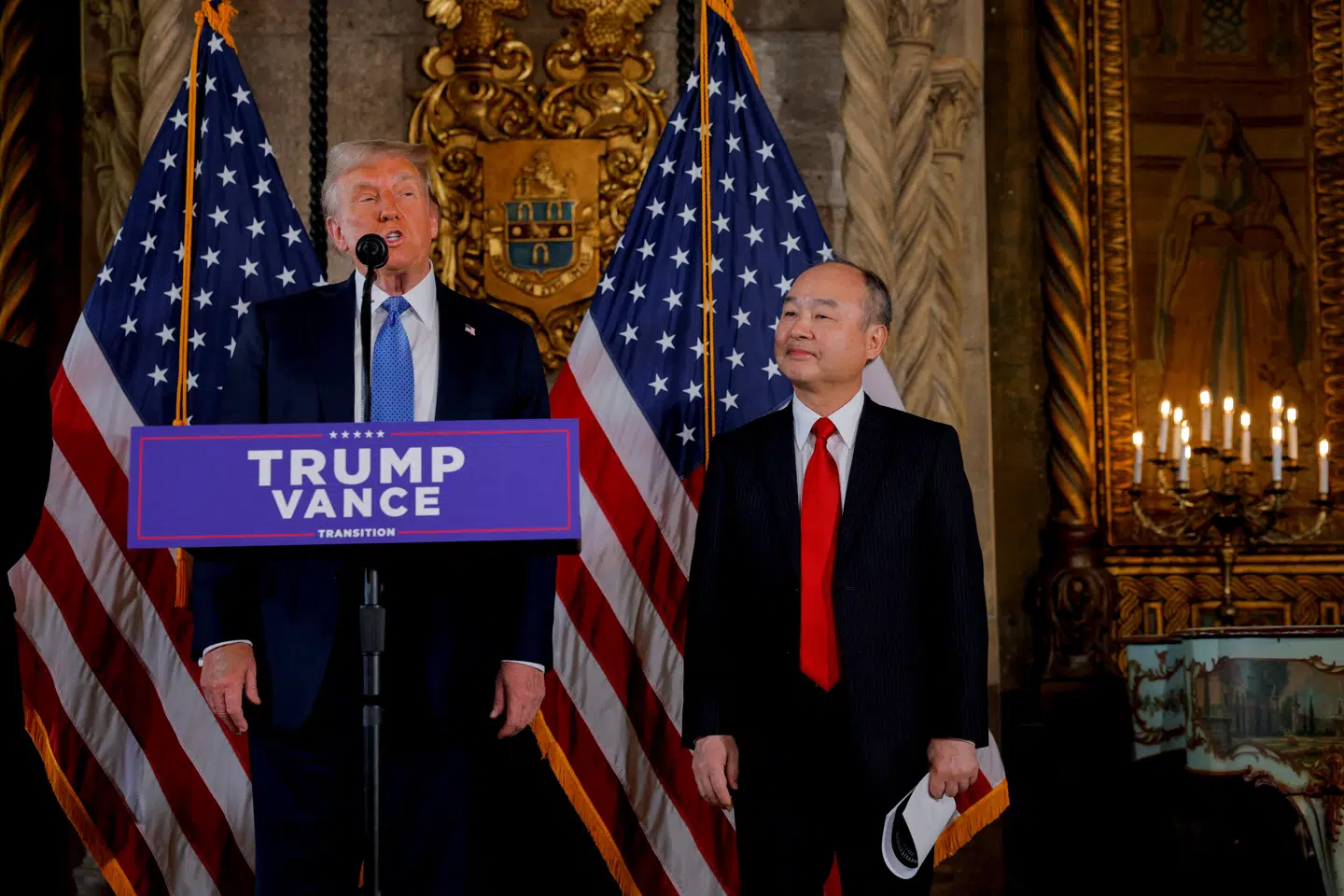 U.S. President-elect Donald Trump delivers remarks next to Chairman and CEO of SoftBank Masayoshi Son, at Mar-a-Lago in Palm Beach, Florida, U.S., December 16, 2024. REUTERS/Brian Snyder