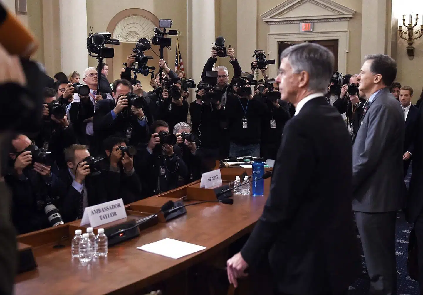 George Kent(R), the deputy assistant secretary of state for European and Eurasian Affairs and Bill Taylor(L), the top diplomat in the US embassy in Ukraine arrive to testify before the House Intelligence Committee for the first public hearings in the impeachment inquiry into US President Donald Trump in Washington, DC on November 13, 2019. - Donald Trump faces the most perilous challenge of his three-year presidency as public hearings convened as part of the impeachment probe against him open under the glare of television cameras on Wednesday. (Photo by Olivier Douliery / AFP)
