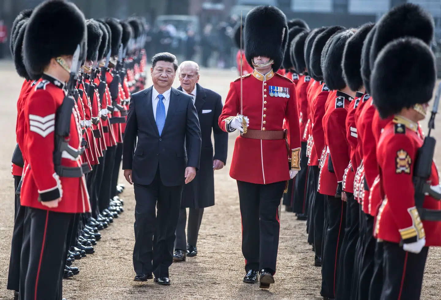 Kinas globale indflydelse vokser, og det får i stadig større grad konsekvenser for landets kritikere, også i udlandet. Her ses Kinas præsident, Xi Jinping, under et besøg i London i 2015. Xi er i dag garant for en stadig mere nationalistisk politik.