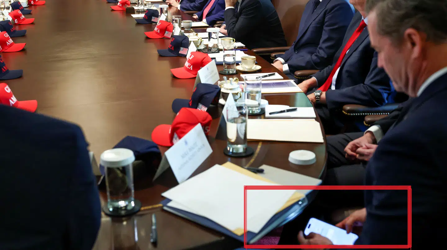 U.S. National Security Advisor Mike Waltz checks his mobile phone while attending a cabinet meeting held by U.S. President Donald Trump at the White House in Washington, D.C., U.S., April 30, 2025. REUTERS/Evelyn Hockstein