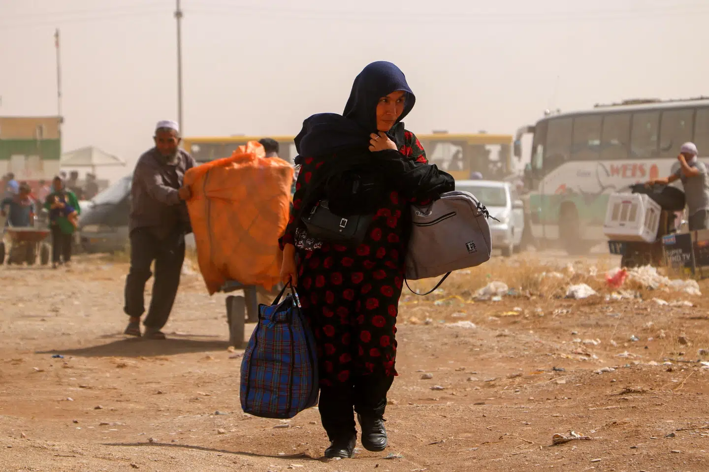 Afghanske flygtninge krydser grænseovergangen Islam Qala mellem Afghanistan og Iran 5. juli 2025.