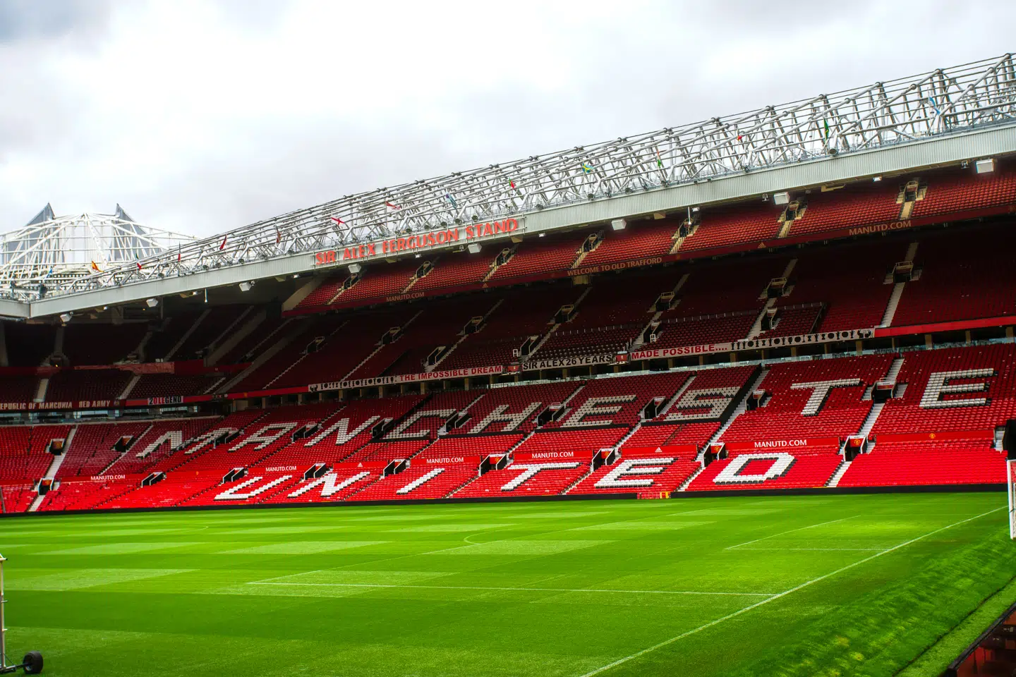 Manchester, England, UK - March 22, 2019 - Football field and Stand in Old Trafford, the home football stadium of Manchester United Team in Premier League