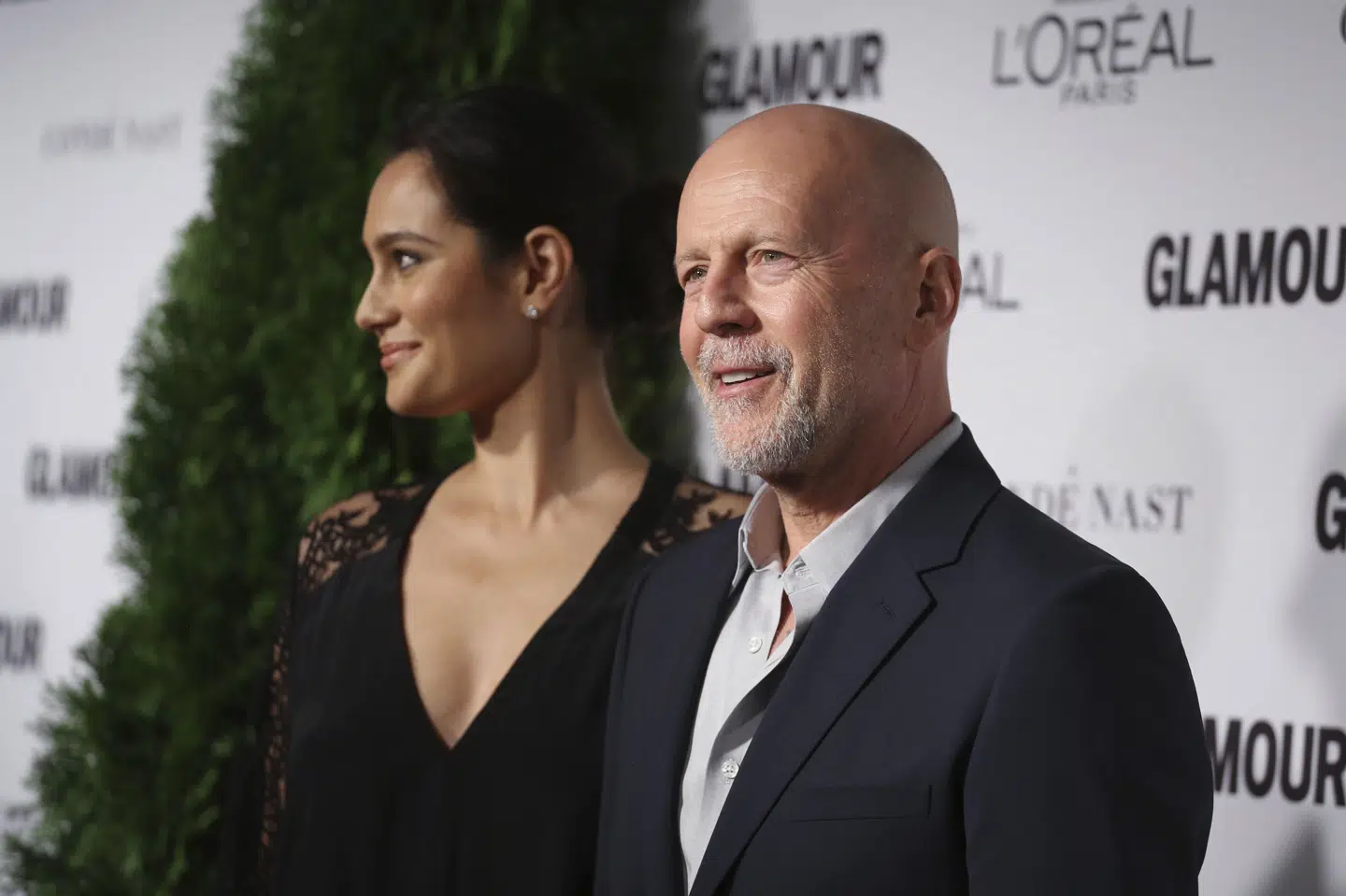 Bruce Willis ses her med sin hustru, Emma Heming Willis, i 2014. (Arkivfoto).