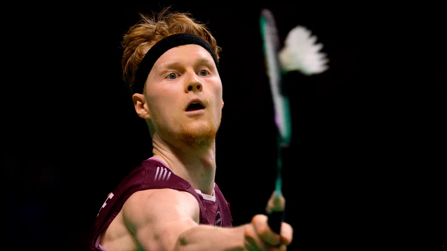 Denmark's Anders Antonsen returns the shuttlecock to Taiwan's Chou Tien-chen during their men's singles semi-final match at the Korea Open badminton tournament in Suwon on September 27, 2025. (Photo by ANTHONY WALLACE / AFP)