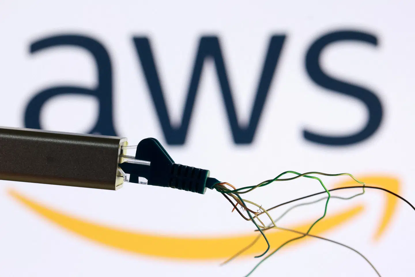 AWS logo and broken ethernet cable are seen in this illustration taken October 20, 2025. REUTERS/Dado Ruvic/Illustration