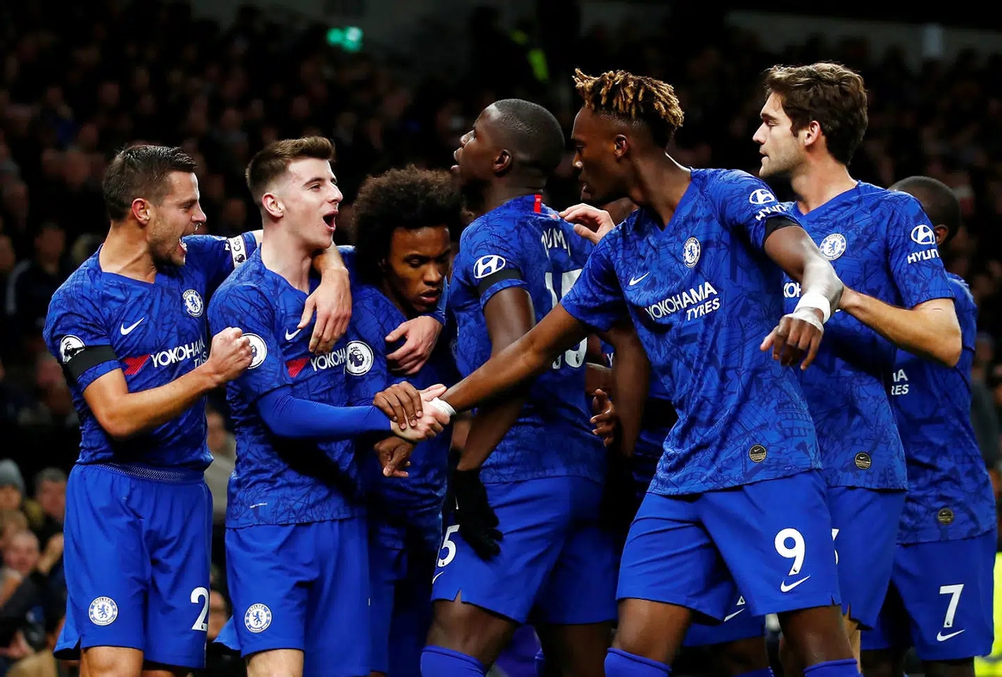Soccer Football - Premier League - Tottenham Hotspur v Chelsea - Tottenham Hotspur Stadium, London, Britain - December 22, 2019 Chelsea's Willian celebrates scoring their first goal with teammates REUTERS/Eddie Keogh EDITORIAL USE ONLY.No use with unauthorized audio, video, data, fixture lists, club/league logos or "live" services. Online in-match use limited to 75 images, no video emulation.No use in betting, games or single club/league/player publications. Please contact your account representative for further details.