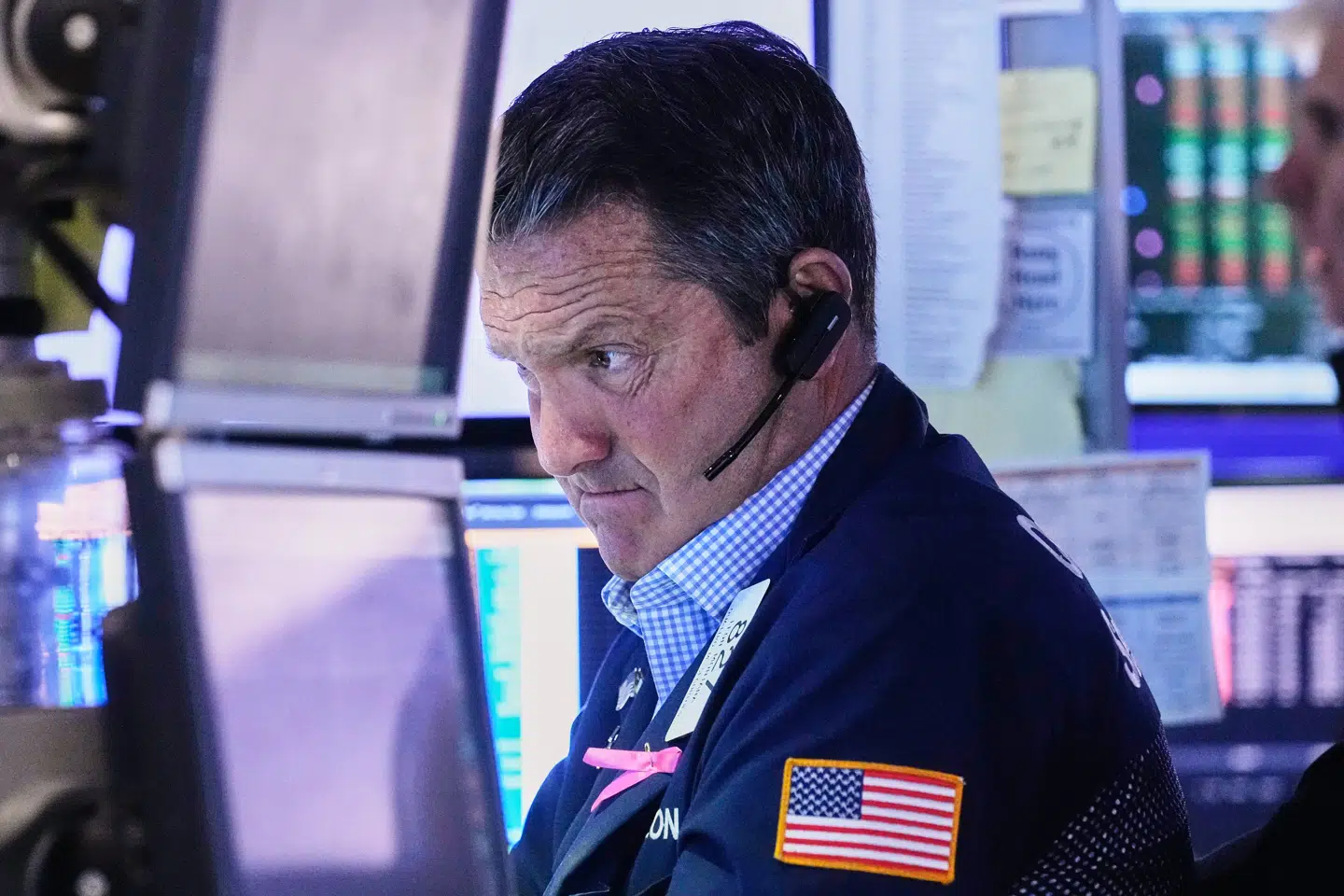 Trader Leon Montana works on the floor of the New York Stock Exchange, Monday, Oct. 27, 2025. (AP Photo/Richard Drew)