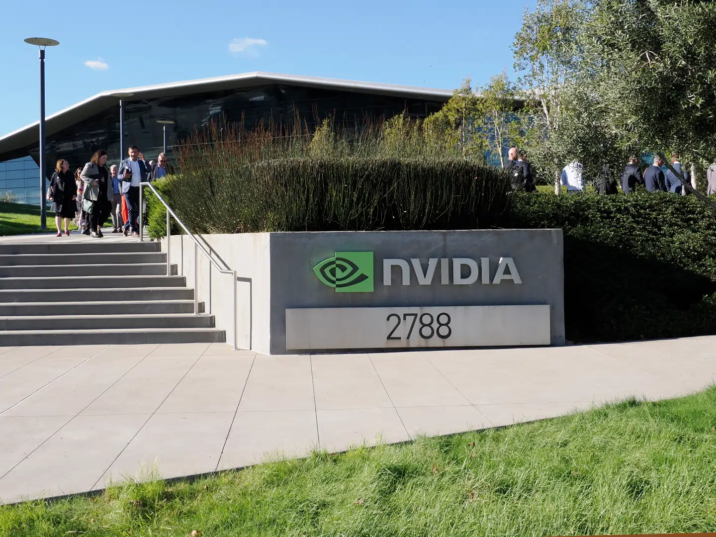 epa12534765 People walk at the Nvidia Corporation headquarters in Santa Clara, California, USA, 18 November 2025. Nvidia will release their earnings report at the end of the trading day on 19 November. EPA/JOHN G. MABANGLO