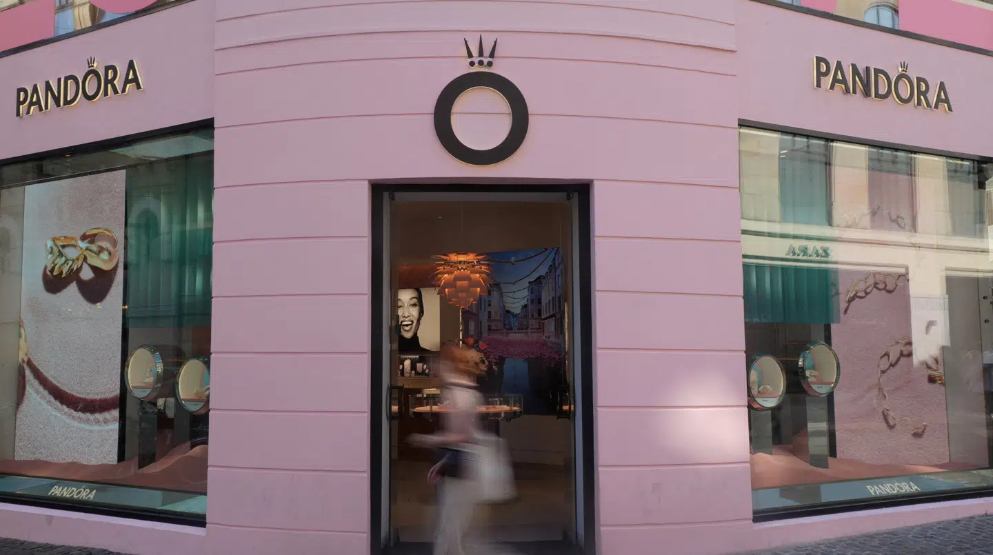 FILE PHOTO: A pedestrian walks past a branch of the Danish jewellery maker Pandora in central Copenhagen, Denmark, August 13, 2025. REUTERS/ Tom Little/File Photo