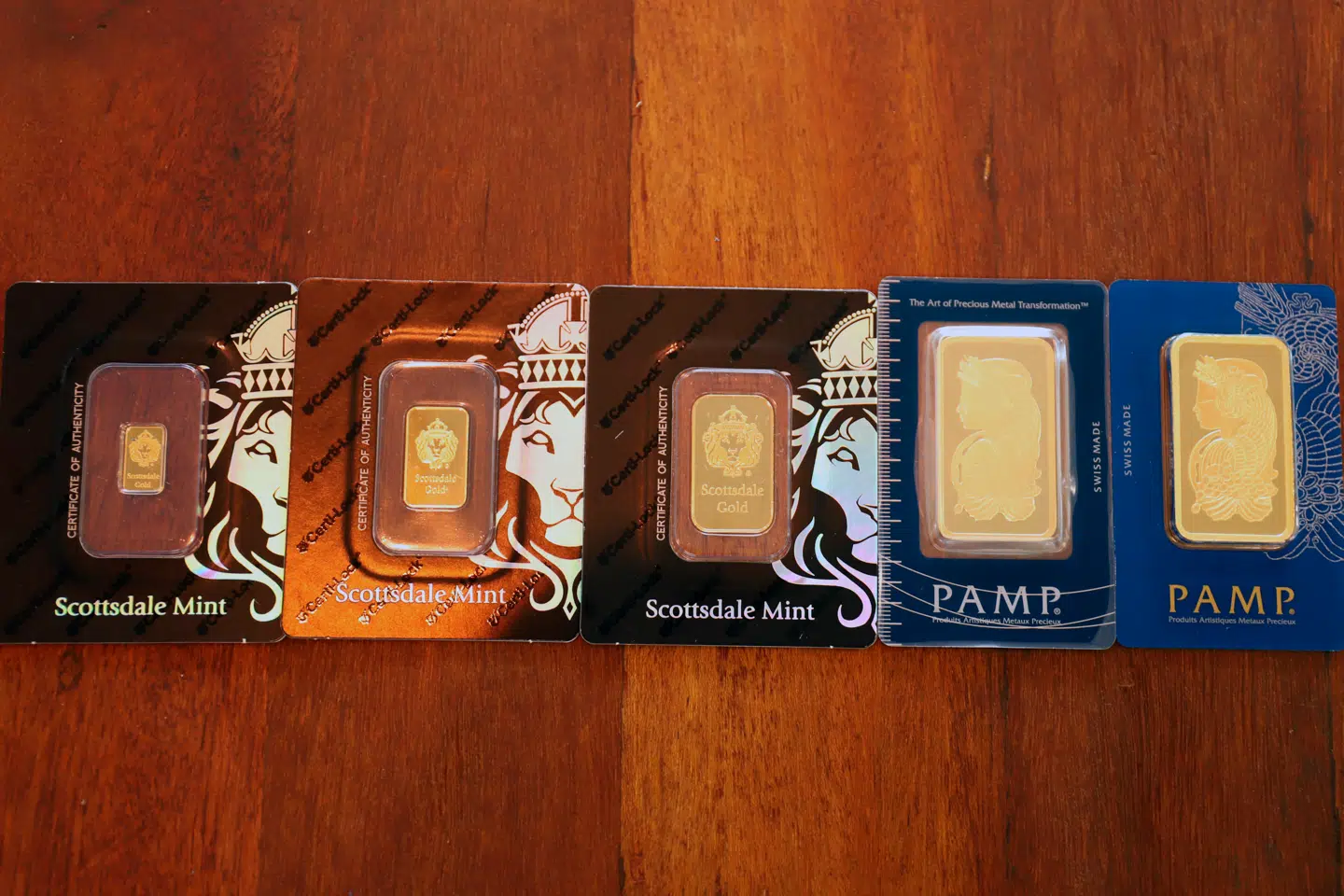 This photograph taken on September 15, 2020 shows gold bars weighing 50 and 100 grams displayed during a media tour of the Singapore Precious Metals Exchange (SGPMX) located at Le Freeport, a private, maximum-security vault in the city-state. Investment in physical gold bars is often thought to be only for the rich, but Victor Foo, chief executive of the Singapore Precious Metals Exchange (SGPMX), says SGPMX is expanding into the mass market, allowing people to start investing for as low as one US dollar through a mobile app. Martin ABBUGAO / AFP