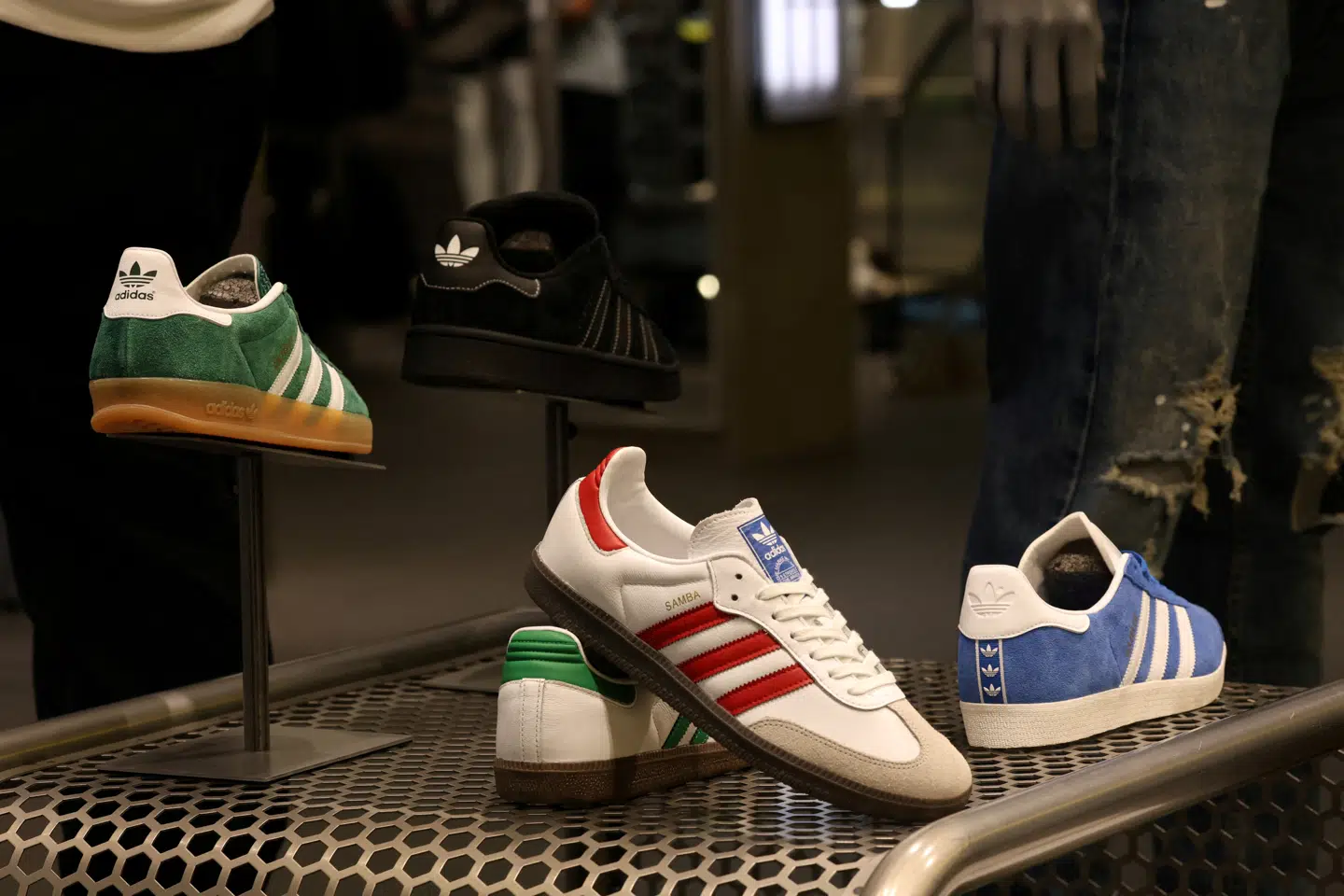 FILE PHOTO: Adidas sneakers are seen on display at the newly renovated JD Sports store at Westfield Stratford City in London, Britain, July 30, 2024. REUTERS/Mina Kim/File Photo