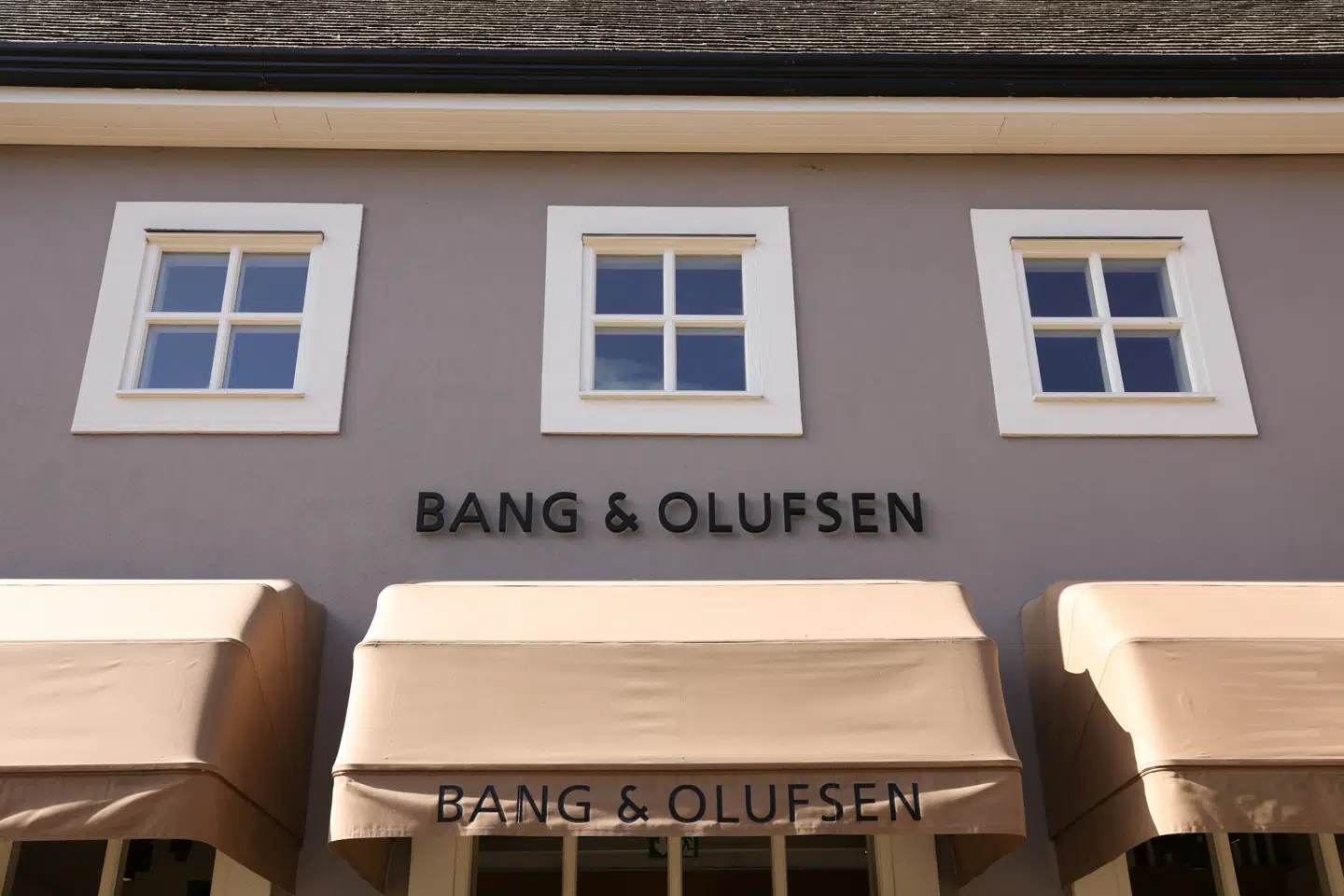 A sign is displayed outside the Bang & Olufsen outlet retail store at Bicester Village in Oxfordshire, Britain, August 21, 2024. REUTERS/Hollie Adams