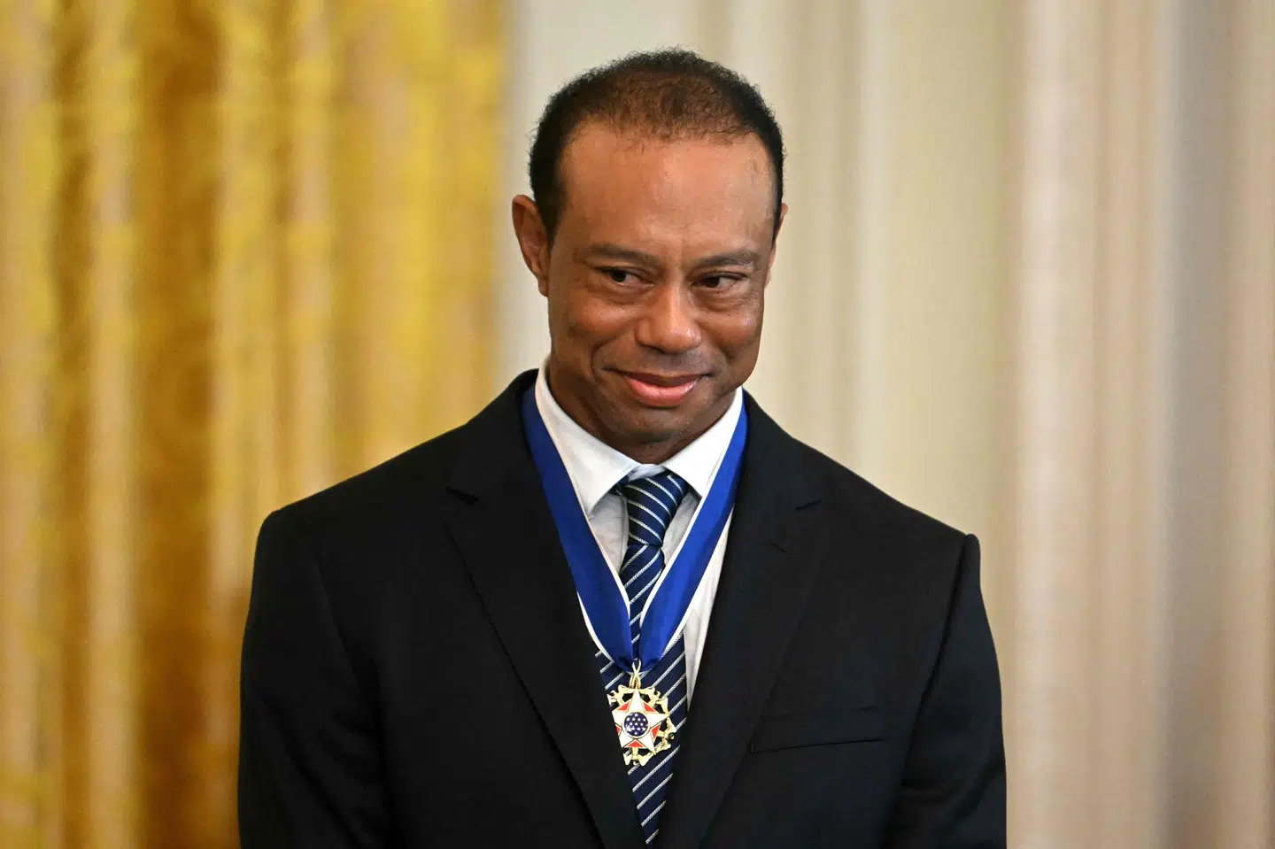 Tiger Woods ses på billedet til arrangement i Det Hvide Hus i februar 2025. Han er fredag blevet anholdt efter bilulykke. (Arkivfoto).