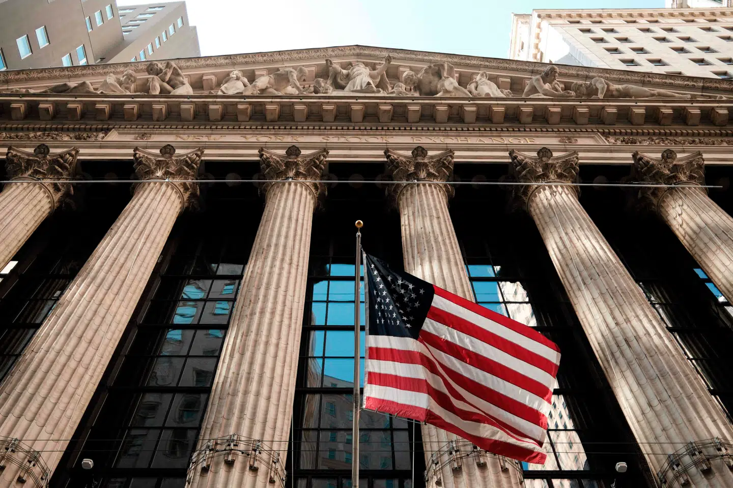 The facade of the New York Stock Exchange (NYSE) is pictured before the closing bell in New York City on April 8, 2026. Wall Street stocks surged, joining a global equity rally after the US-Iran truce sent oil prices sharply lower. The Dow Jones Industrial Average finished at 47, 909.92, rising more than 1, 300 points or 2.9 percent. The broad-based S&P 500 jumped 2.5 percent to 6, 782.81, while the tech-rich Nasdaq Composite Index advanced 2.8 percent to 22, 634.99. (Photo by CHARLY TRIBALLEAU / AFP)