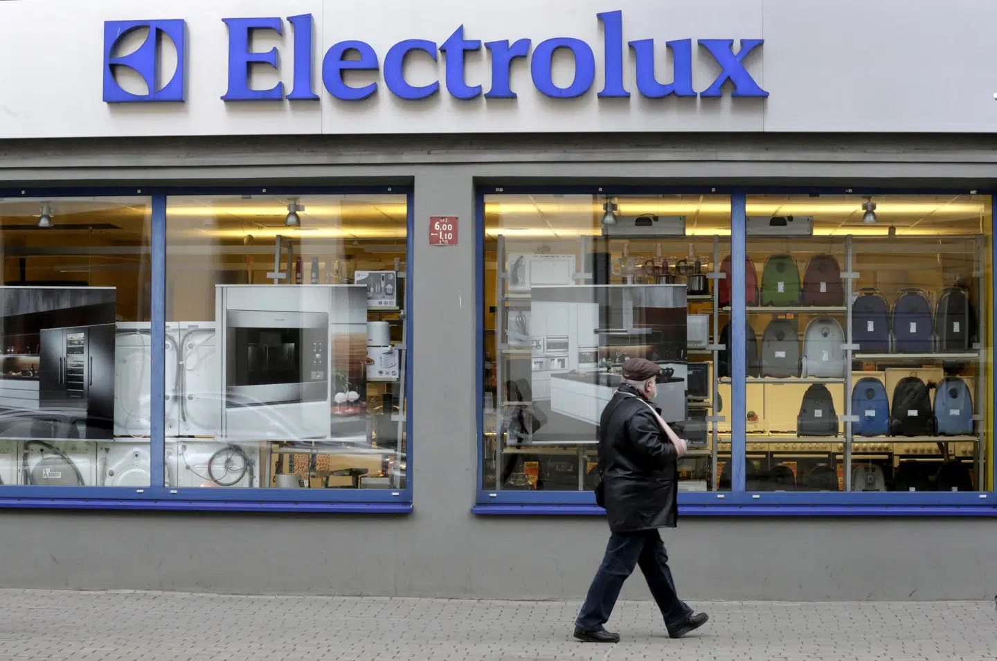 FILE PHOTO: A man walks past an Electrolux shop in Riga, Latvia, November 12, 2013. REUTERS/Ints Kalnins/File Photo