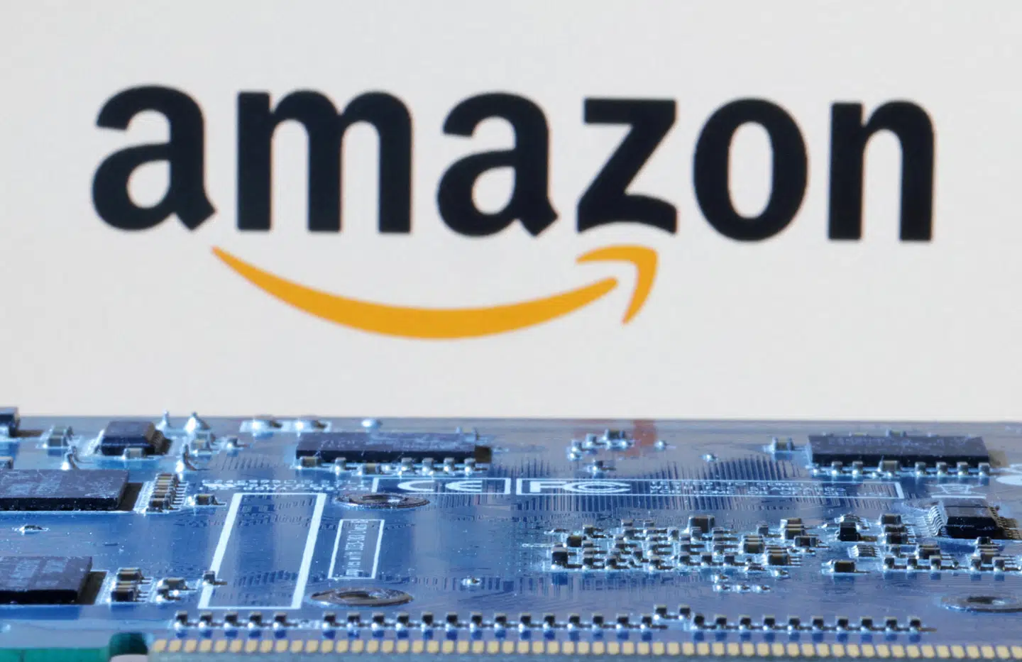 FILE PHOTO: Amazon logo is seen near computer motherboard in this illustration taken January 8, 2024. REUTERS/Dado Ruvic/Illustration/File Photo