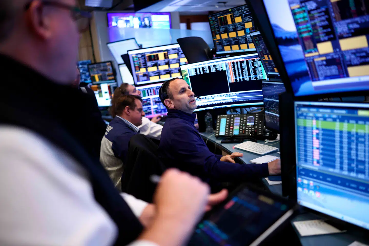 Traders work on the floor of the New York Stock Exchange (NYSE) before the closing bell in New York City on April 8, 2026. Wall Street stocks surged on April 8, joining a global equity rally after the US-Iran truce sent oil prices sharply lower. The Dow Jones Industrial Average finished at 47, 909.92, rising more than 1, 300 points or 2.9 percent. (Photo by CHARLY TRIBALLEAU / AFP)