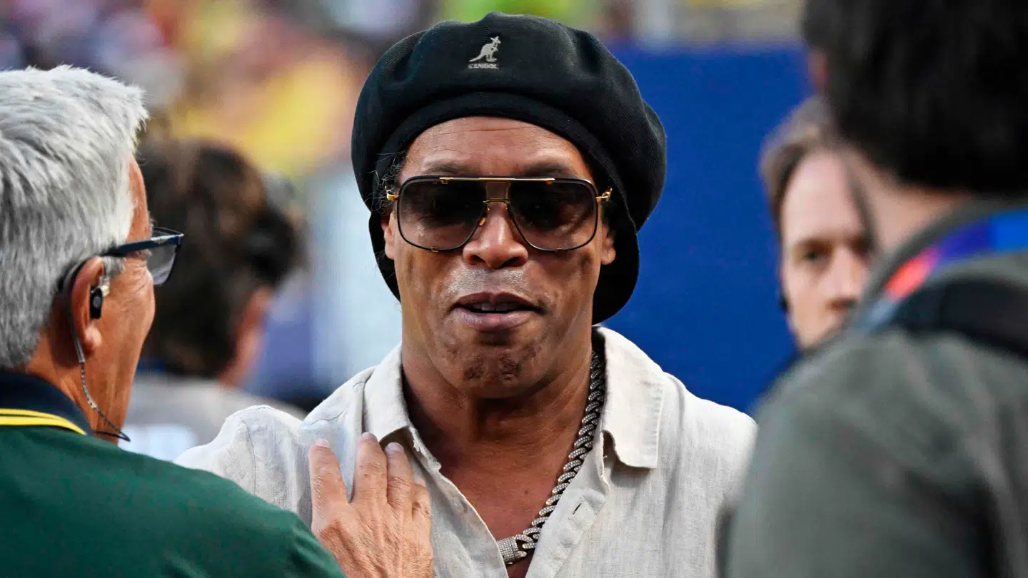 Brazilian former football star Ronaldinho gestures ahead of the 2026 World Cup Group C football match between Brazil and Haiti at the Philadelphia Stadium in Philadelphia on June 19, 2026. (Photo by Mauro PIMENTEL / AFP)