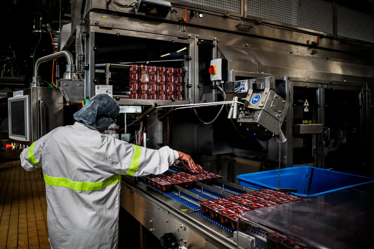 An employee of Danone works on the Danette production line at the Danone factory in Saint-Just-Chaleyssin, southeastern France on September 17, 2025. JEFF PACHOUD / AFP