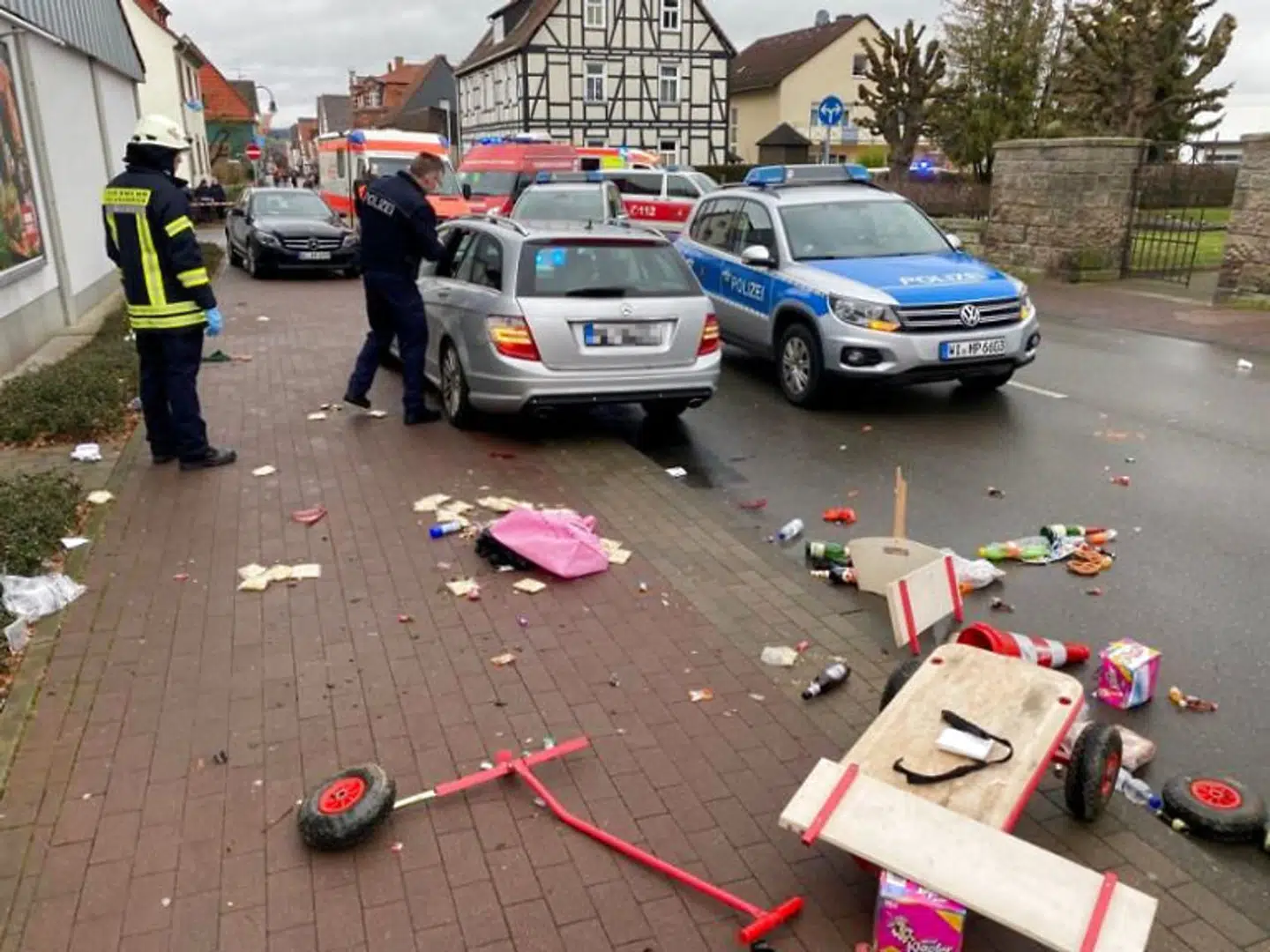 People react at the scene after a car ploughed into a carnival parade injuring several people in Volkmarsen, Germany February 24, 2020. ATTENTION:NUMBER PLATE WAS PIXELATED FROM SOURCE. Elmar Schulten/Waldeckische Landeszeitung via REUTERS.NO RESALES.NO ARCHIVES