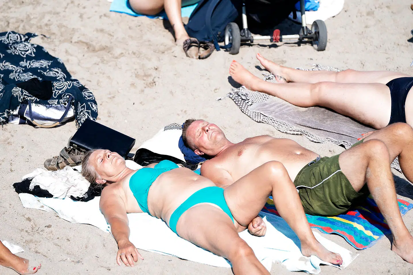 Her ses folk ligge og tage sol ved Svanemøllen Strand i København, lørdag den 8. august 2020.