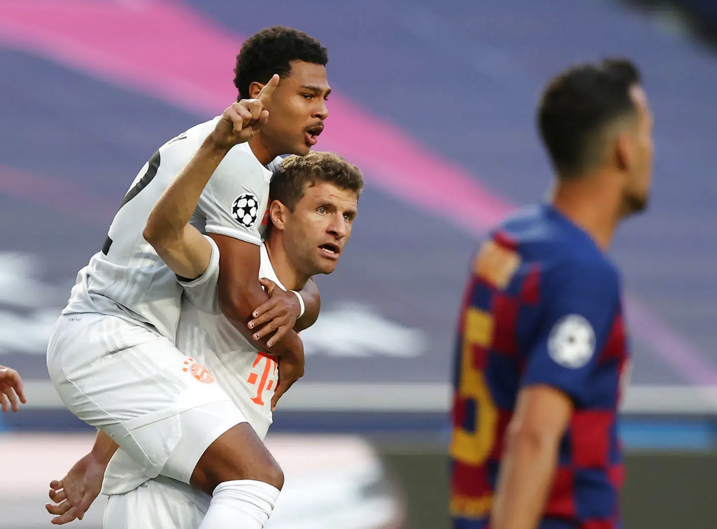 Soccer Football - Champions League - Quarter Final - FC Barcelona v Bayern Munich - Estadio da Luz, Lisbon, Portugal - August 14, 2020 Bayern Munich's Thomas Muller celebrates scoring their first goal with Serge Gnabry, as play resumes behind closed doors following the outbreak of the coronavirus disease (COVID-19) REUTERS/Rafael Marchante/Pool