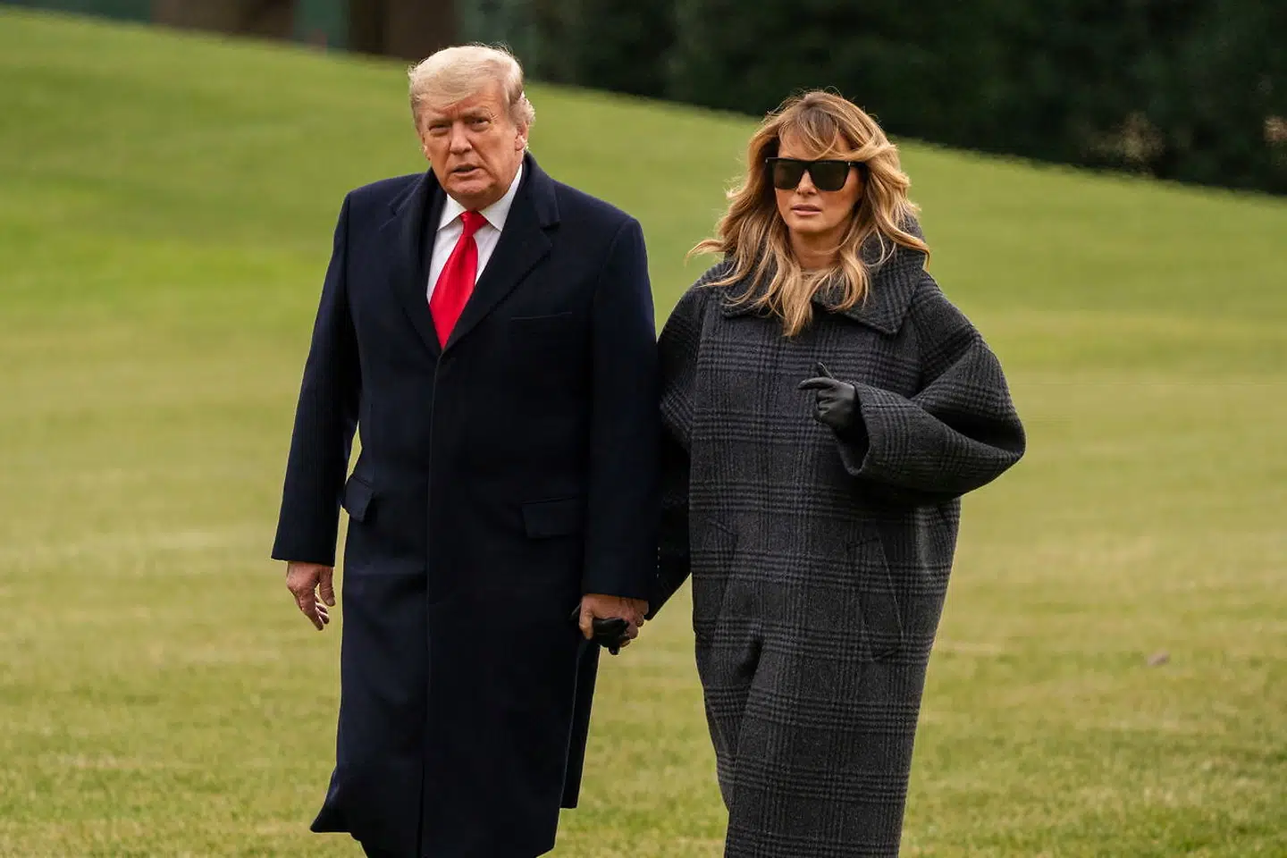 Donald og Melania Trump fotograferet, da de 31. januar rejste tilbage til Washington fra deres juleferie i Florida.