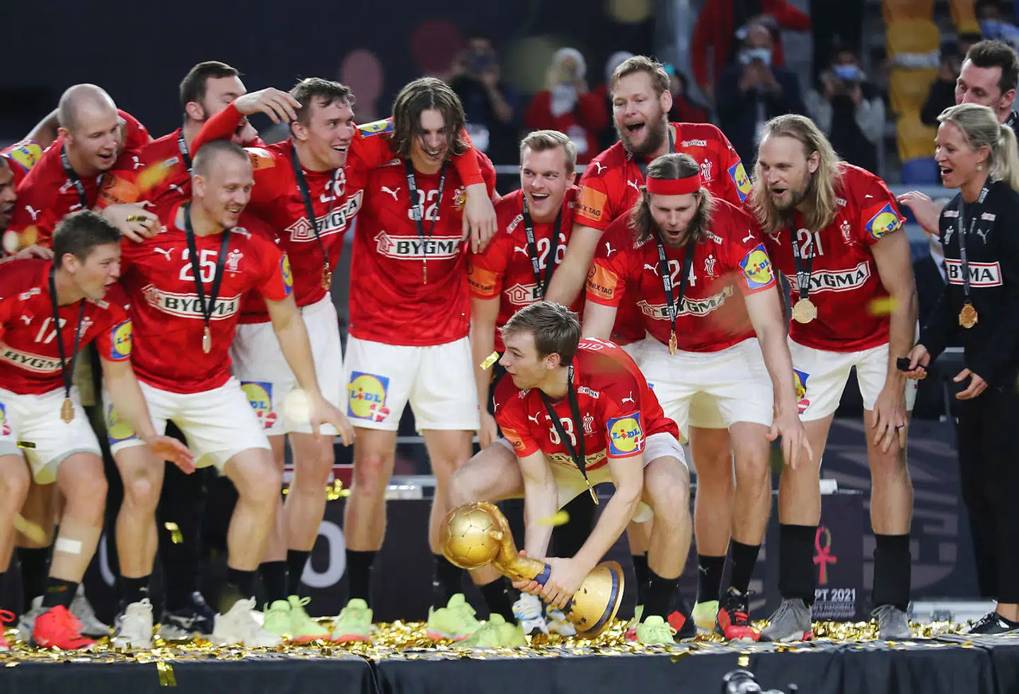Handball - 2021 IHF Handball World Championship - Gold Medal Match - Denmark v Sweden - Cairo Stadium Hall 1, Cairo, Egypt - January 31, 2021 Denmark's Mathias Gidsel celebrates with the trophy and teamates after winning the Gold Medal Match REUTERS/Mohamed Abd El Ghany