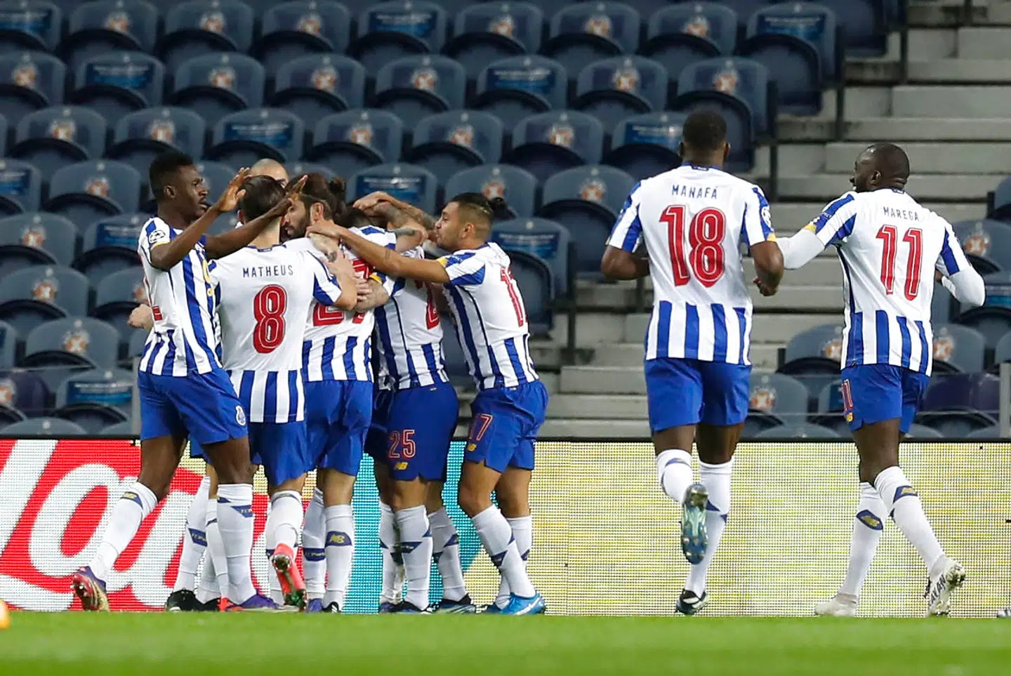 Soccer Football- Champions League - Round of 16 First Leg - FC Porto v Juventus - Estadio do Dragao, Porto, Portugal - February 17, 2021 FC Porto's Mehdi Taremi celebrates scoring their first goal with teammates REUTERS/Pedro Nunes