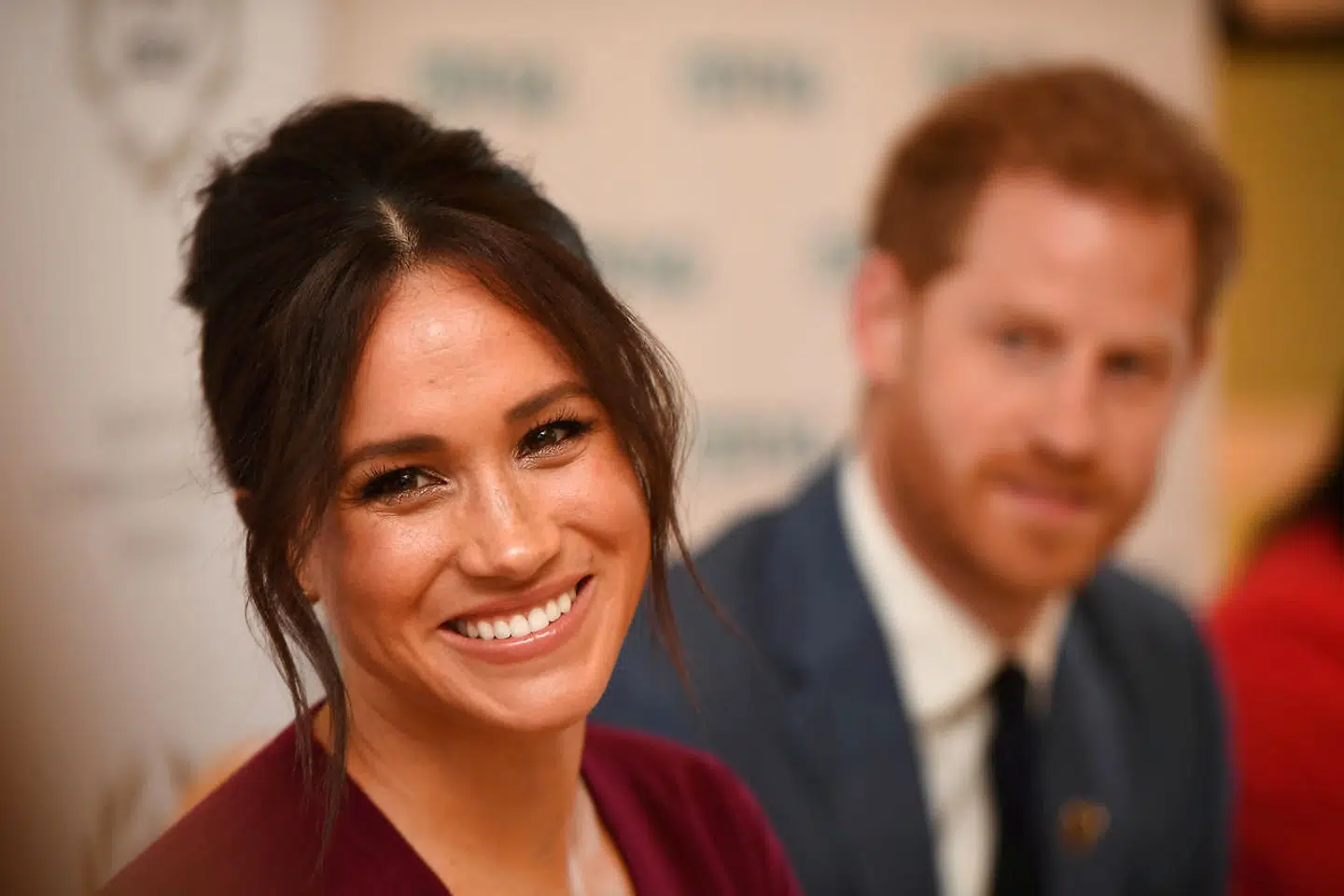 FILE PHOTO: Britain's Meghan, the Duchess of Sussex, and Prince Harry, Duke of Sussex, attend a roundtable discussion on gender equality with The Queen's Commonwealth Trust (QCT) and One Young World at Windsor Castle, Windsor, Britain October 25, 2019. Jeremy Selwyn/Pool via REUTERS/File Photo