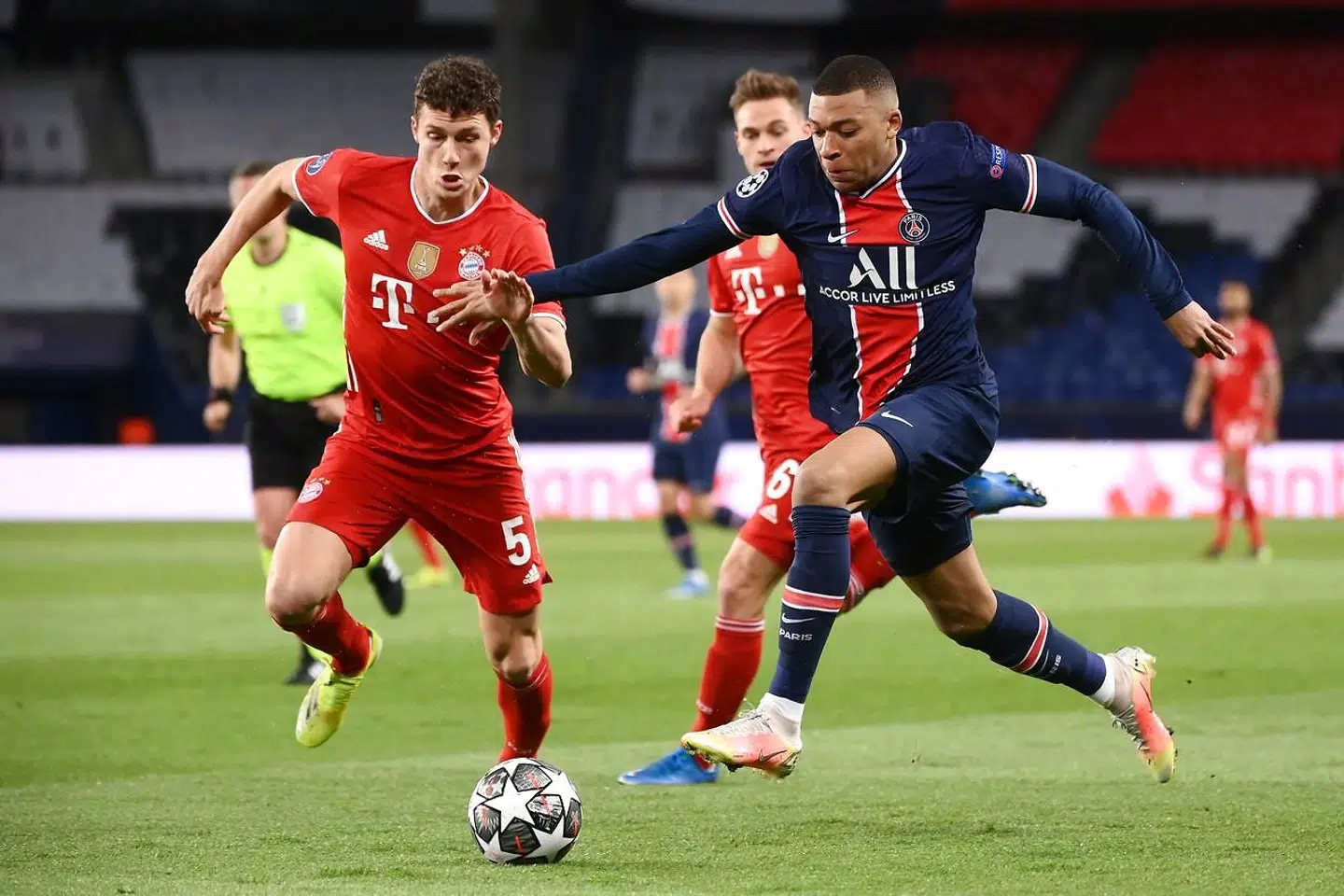 Paris Saint-Germain's French forward Kylian Mbappe (R) fights for the ball with Bayern Munich's French defender Benjamin Pavard during the UEFA Champions League quarter-final second leg football match between Paris Saint-Germain (PSG) and FC Bayern Munich at the Parc des Princes stadium in Paris, on April 13, 2021. (Photo by FRANCK FIFE / AFP)