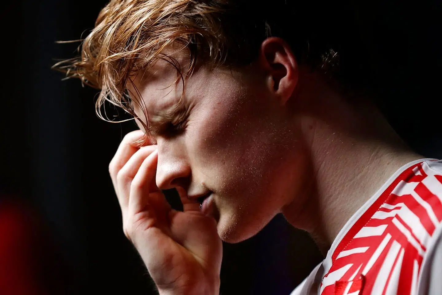 Denmark's Anders Antonsen talks to the media after losing to Denmark's Viktor Axelsen during their men's singles semi-final match on day four of the All England Open Badminton Championship at the Utilita Arena in Birmingham, central England, on March 20, 2021. (Photo by Adrian DENNIS / AFP)