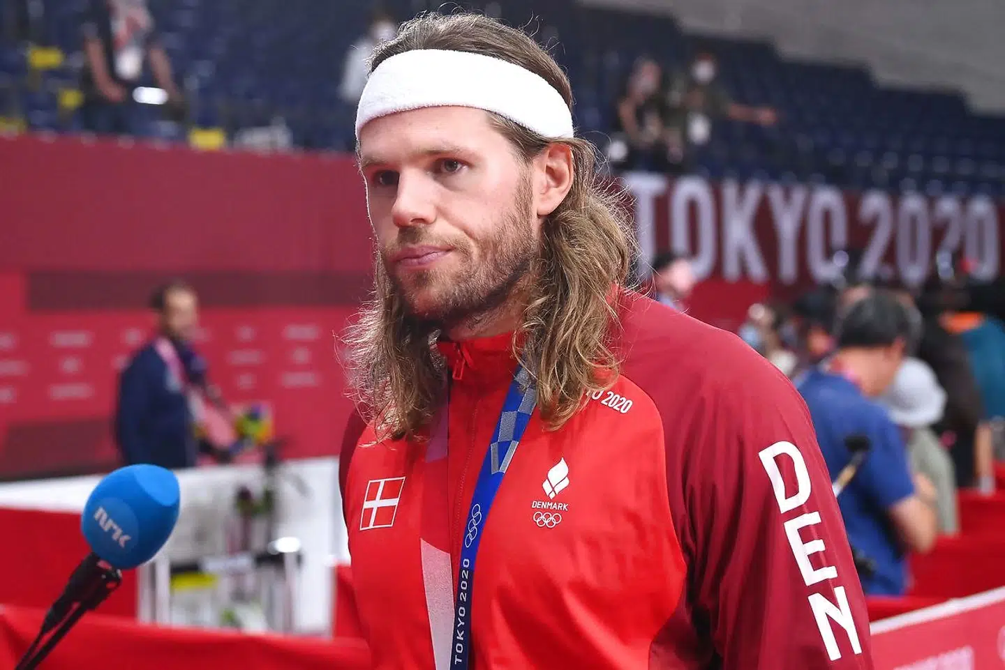 Denmark's left back Mikkel Hansen speaks with journalists after the medals ceremony for the men's final handball at the Tokyo 2020 Olympic Games at the Yoyogi National Stadium in Tokyo on August 7, 2021. (Photo by Franck FIFE / AFP)