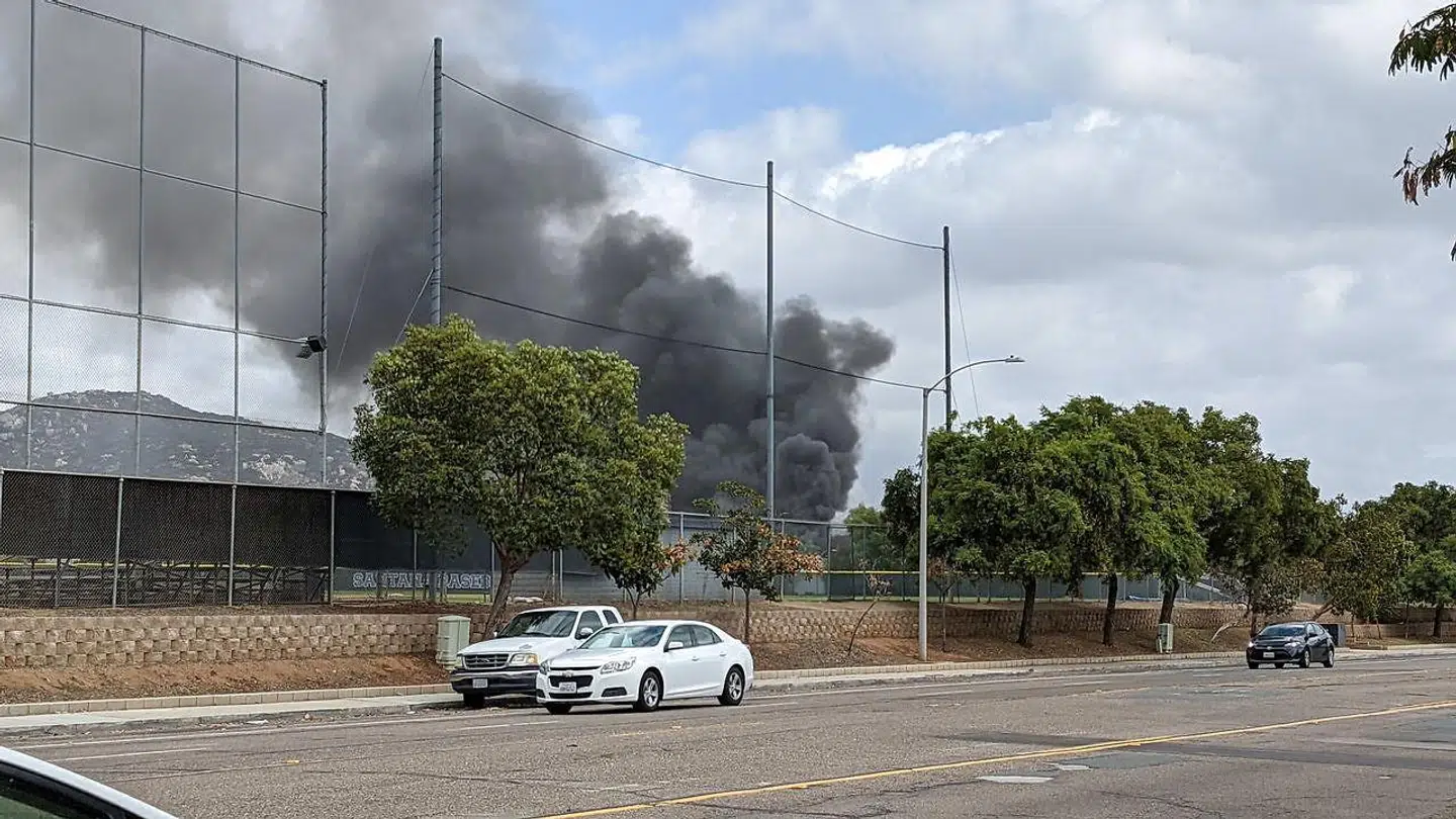 Smoke billows after a plane crash in Santee, California, U.S., October 11, 2021. Courtesy of Ryan Graves/Handout via REUTERS THIS IMAGE HAS BEEN SUPPLIED BY A THIRD PARTY. MANDATORY CREDIT