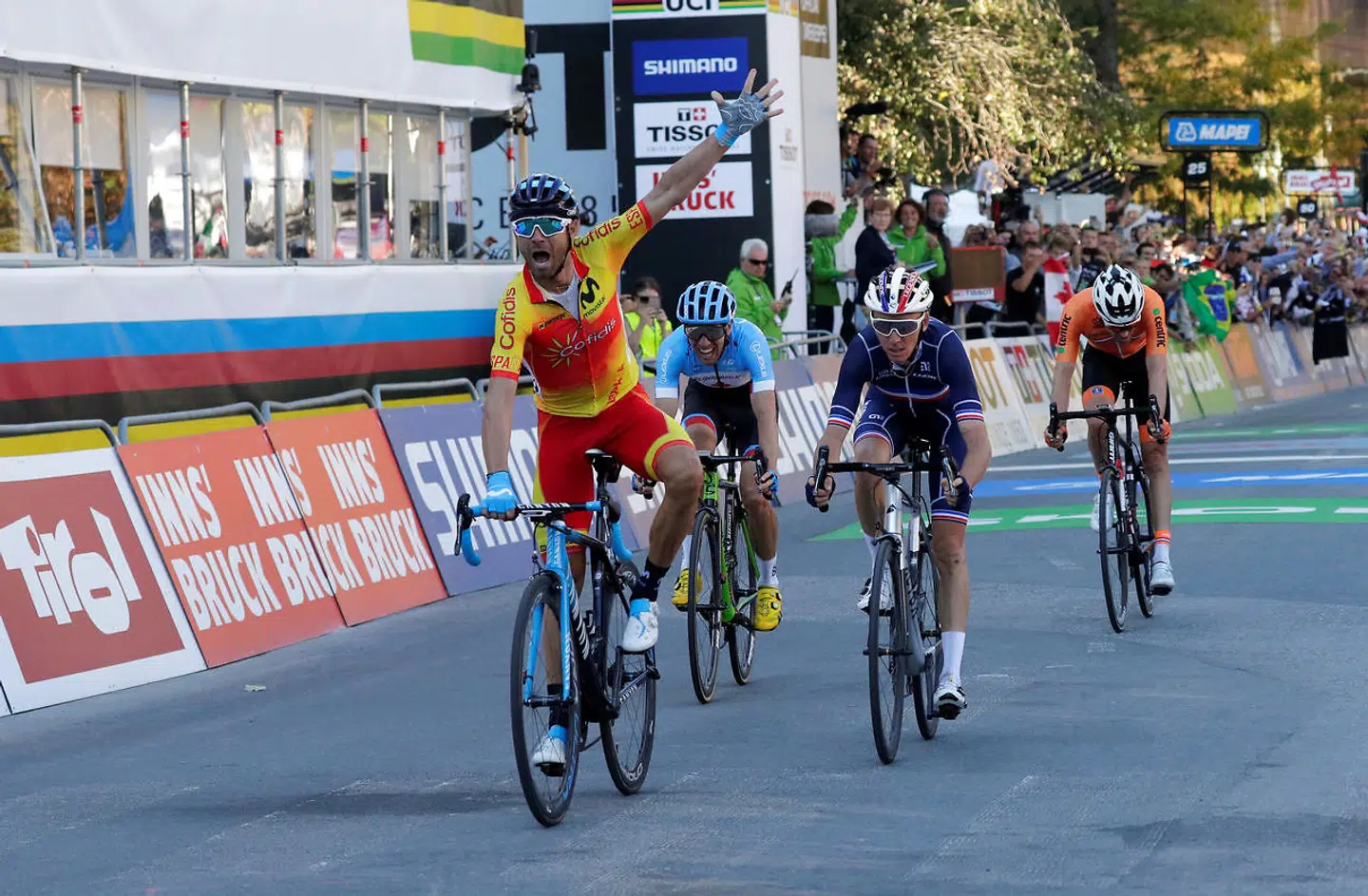 Cycling - UCI Road Cycling World Championships - Innsbruck-Tirol, Austria - September 30, 2018 Spain's Alejandro Valverde celebrates as he wins the Men's Elite Road Race REUTERS/Heinz-Peter Bader