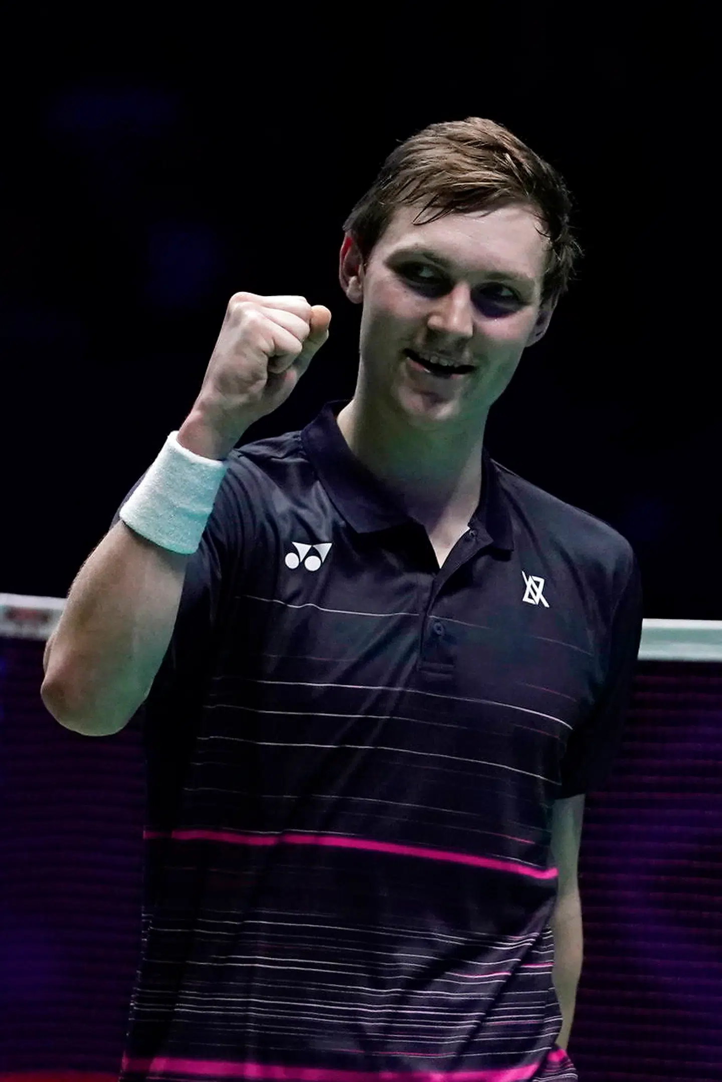 epa07425393 Denmark's Viktor Axelsen celebrates after beating China's Shi Yuqi during their men's singles semi final match at the All England Open Badminton Championships at the National Indoor Arena, Birmingham, Britain, 09 March 2019. EPA/WILL OLIVER