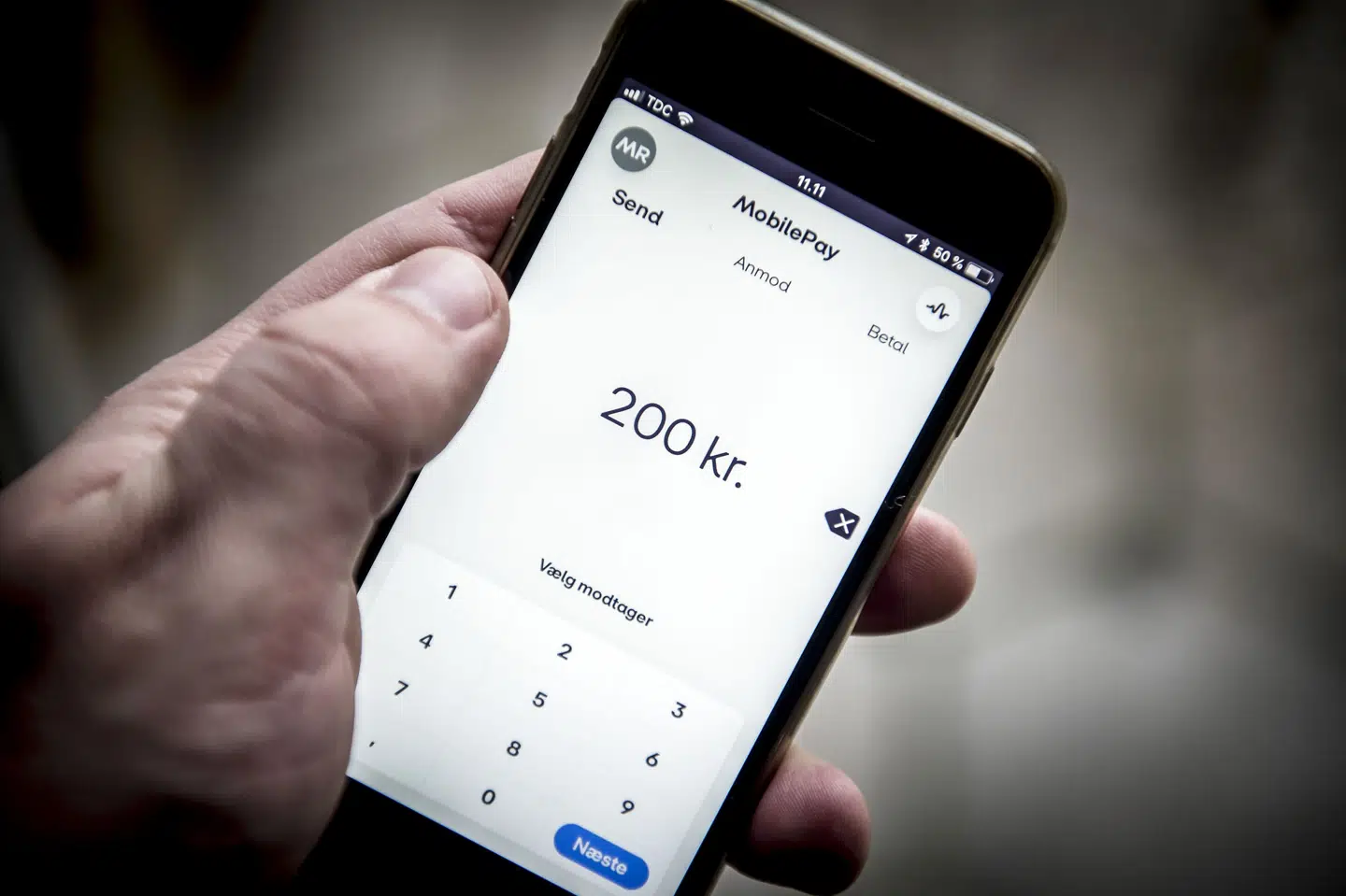 På nuværende tidspunkt kan man ikke overføre penge til andre nordiske lande via en mobilbetalingsapp. Men en fusion mellem danske MobilePay og norske Vipps kan gøre det muligt. Fredag har Danske Bank meddelt, at relevante myndigheder, herunder EU-Kommissionen, har godkendt fusionen. (Arkivfoto). Mads Claus Rasmussen/Ritzau Scanpix