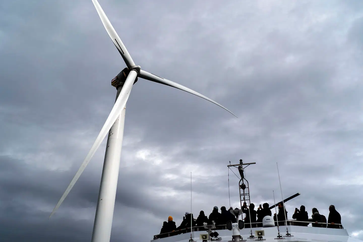 Guests tour one of the turbines of America's first offshore wind farm, owned by the Danish company, Orsted, off the coast of Block Island, R.I., as part of a wind power conference, Monday, Oct. 17, 2022. Hundreds of offshore wind developers and experts gathered in Rhode Island to talk about the future of clean energyó how to grow the offshore wind industry and address shared challenges. (AP Photo/David Goldman)