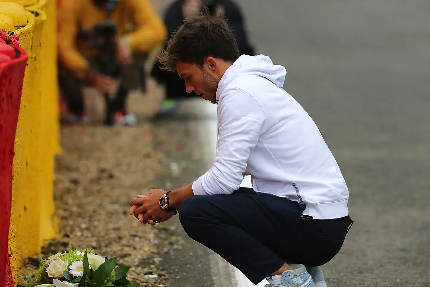 August 26th, 2021, Circuit de Spa-Francorchamps, Spa-Franchorchamps, FORMULA 1 ROLEX BELGIAN GRAND PRIX 2021, in the picture Pierre Gasly (FRA # 10), Scuderia AlphaTauri Honda lays a bouquet of flowers at the scene of the accident where the fatally injured Anthoine Hubert had an accident. Photo by: Hasan Bratic/picture-alliance/dpa/AP Images