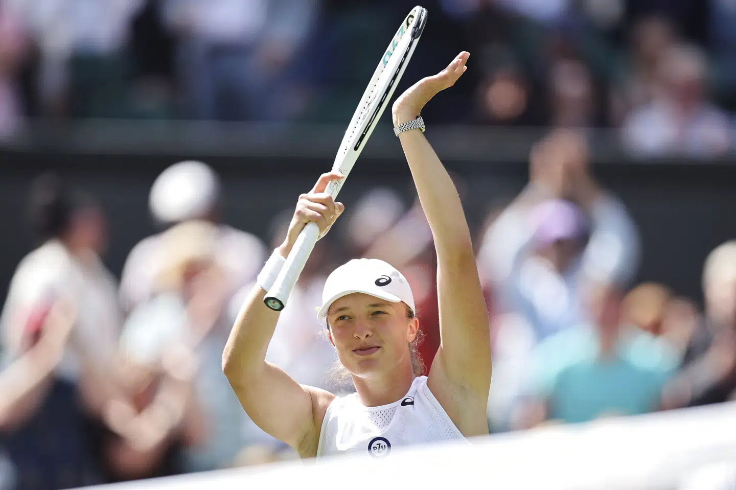 Iga Swiatek er videre til anden runde i Wimbledon efter sejr i to sæt over Jana Fett. Takuya Matsumoto/Ritzau Scanpix